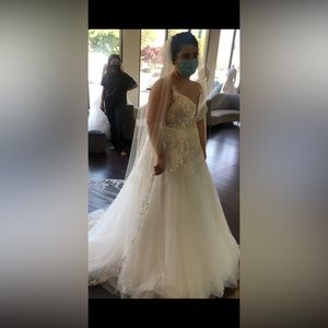 Brand new wedding dress unfortunately I was never able to wear it.